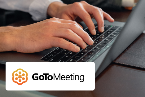 Hands typing on laptop with GoToMeeting logo